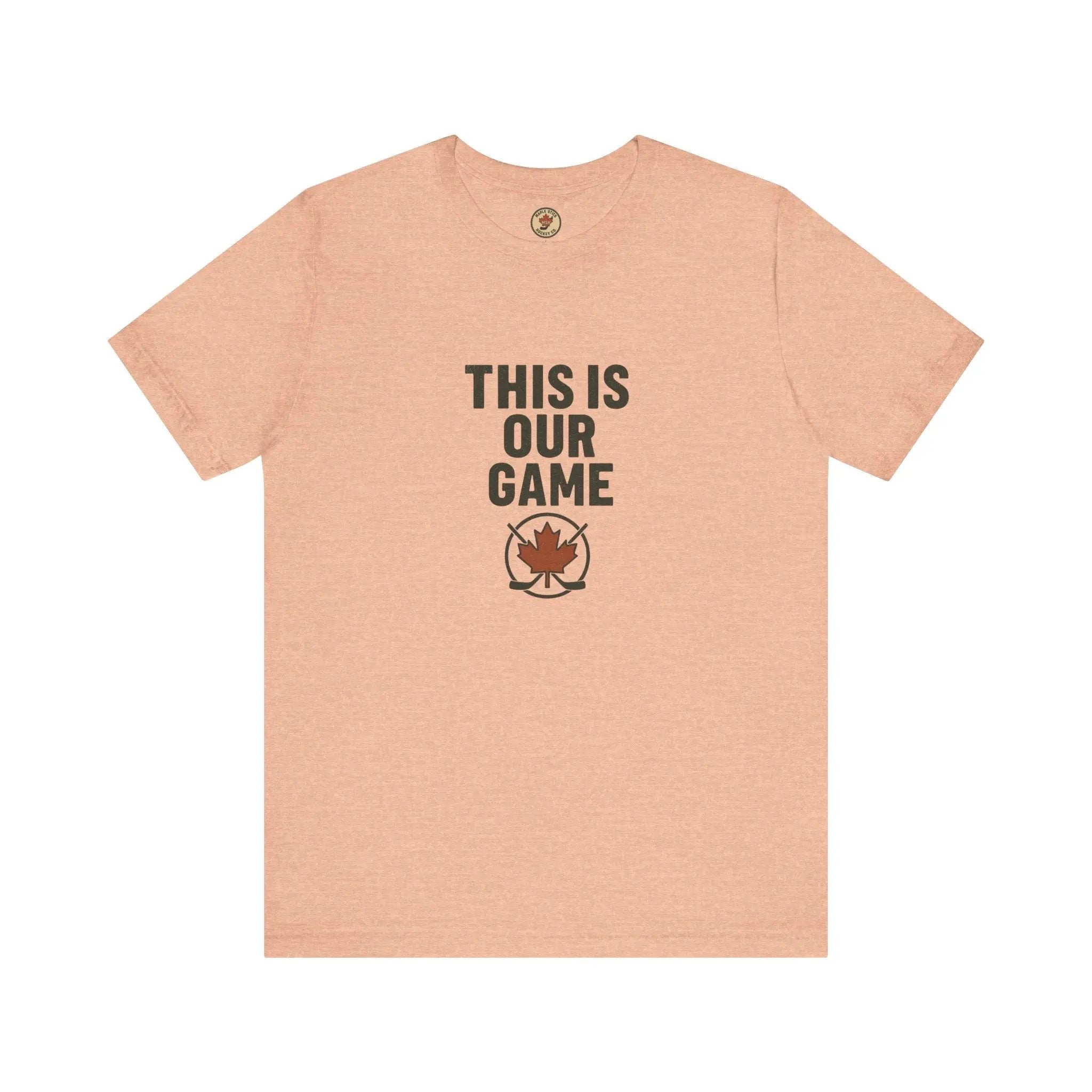 Beige women’s T-shirt with ‘This Is Our Game’ text and maple leaf graphic – Maple Stick Hockey product.