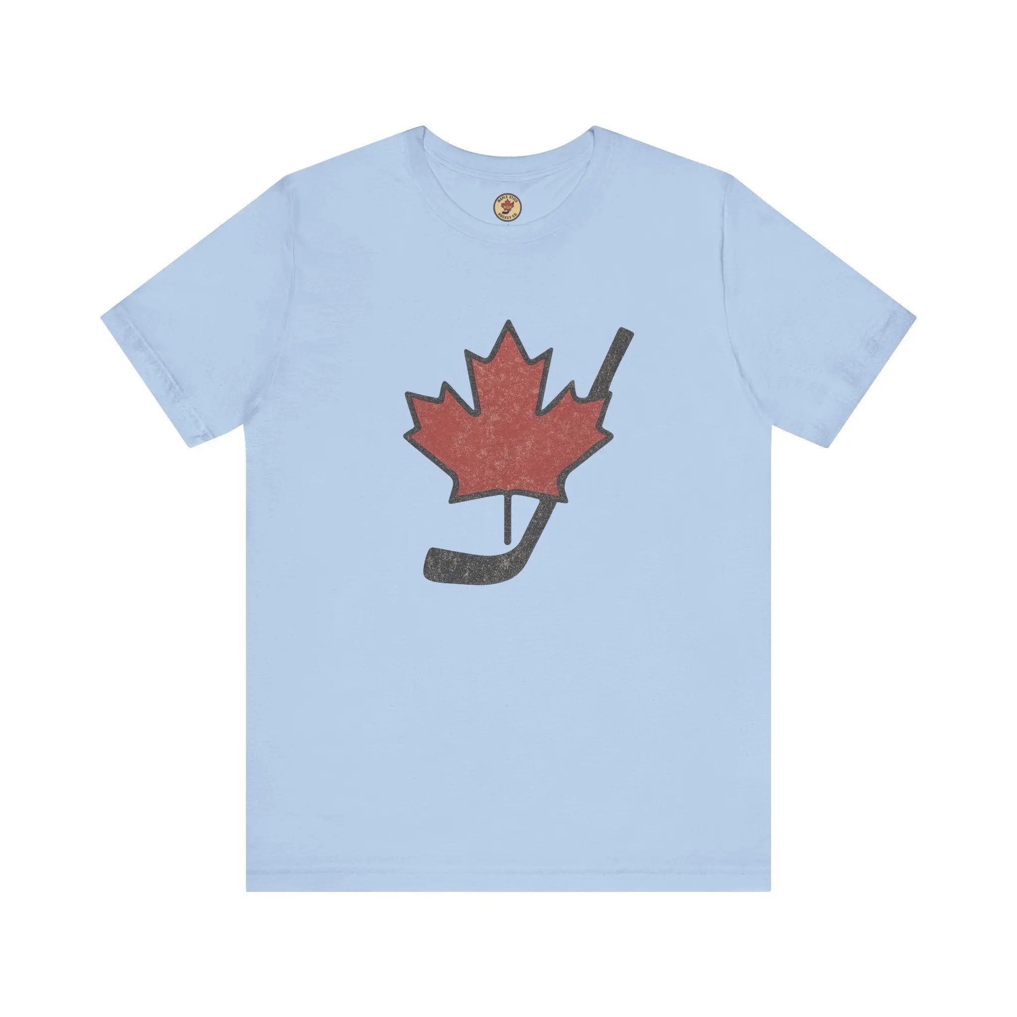 Light blue T-shirt with red maple leaf and hockey stick graphic on front