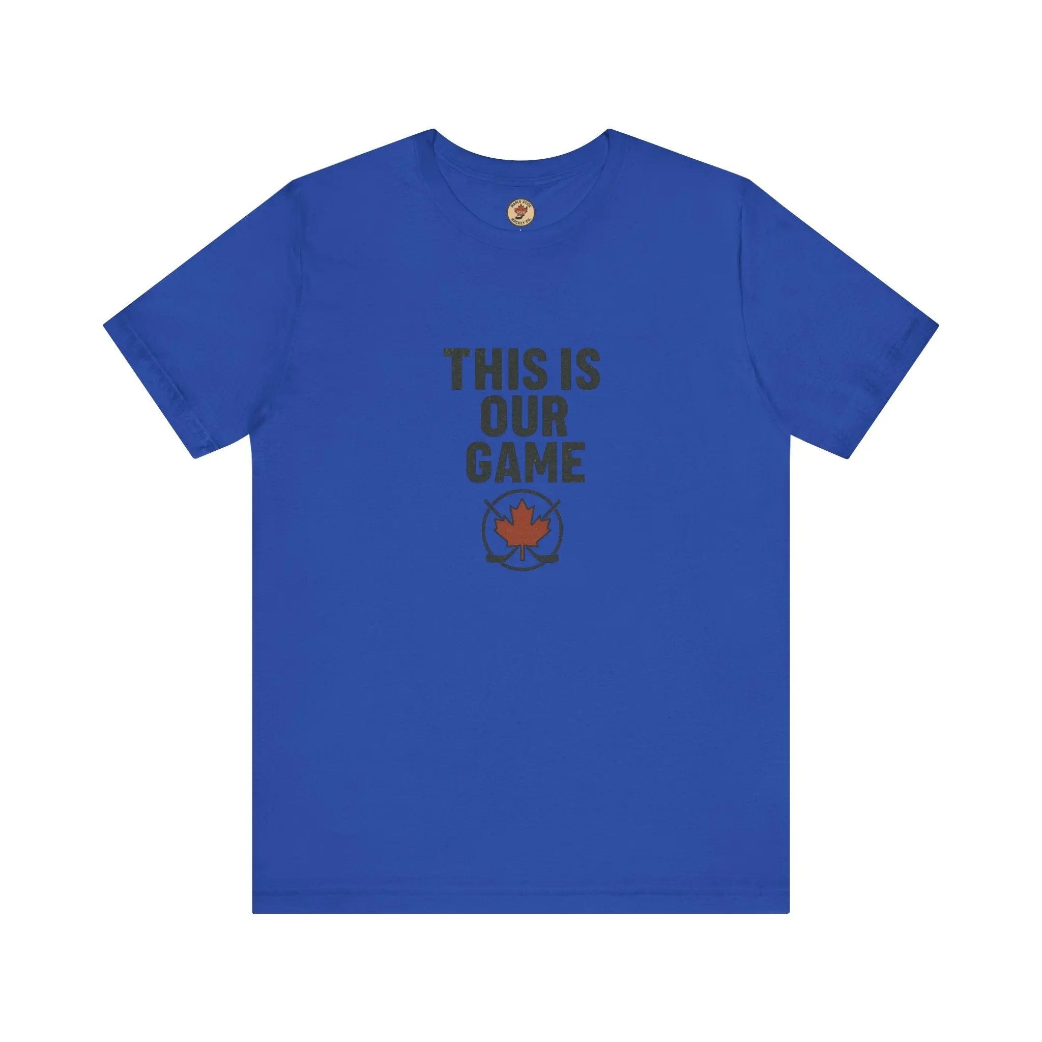 Blue women’s T-shirt with ‘This Is Our Game’ text and maple leaf graphic – Maple Stick Hockey product.