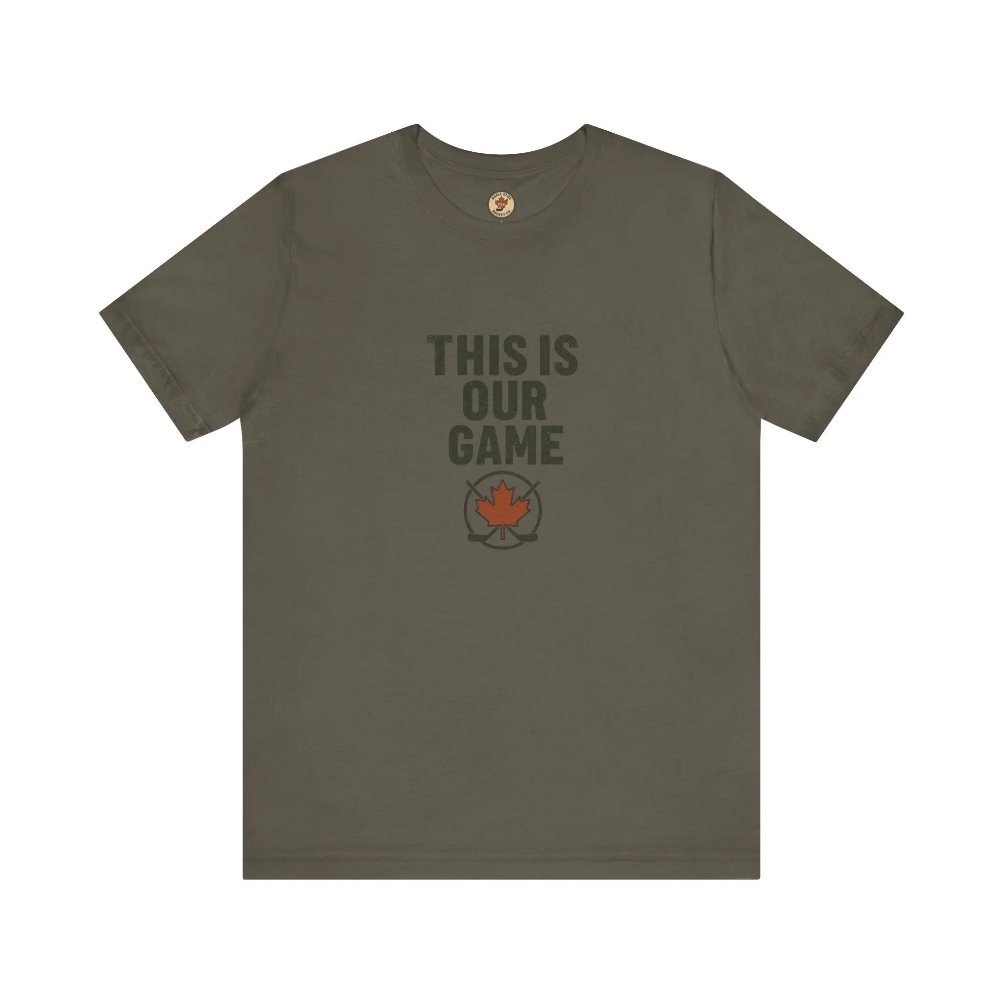 Green women’s T-shirt with ‘This Is Our Game’ text and maple leaf graphic – Maple Stick Hockey product.