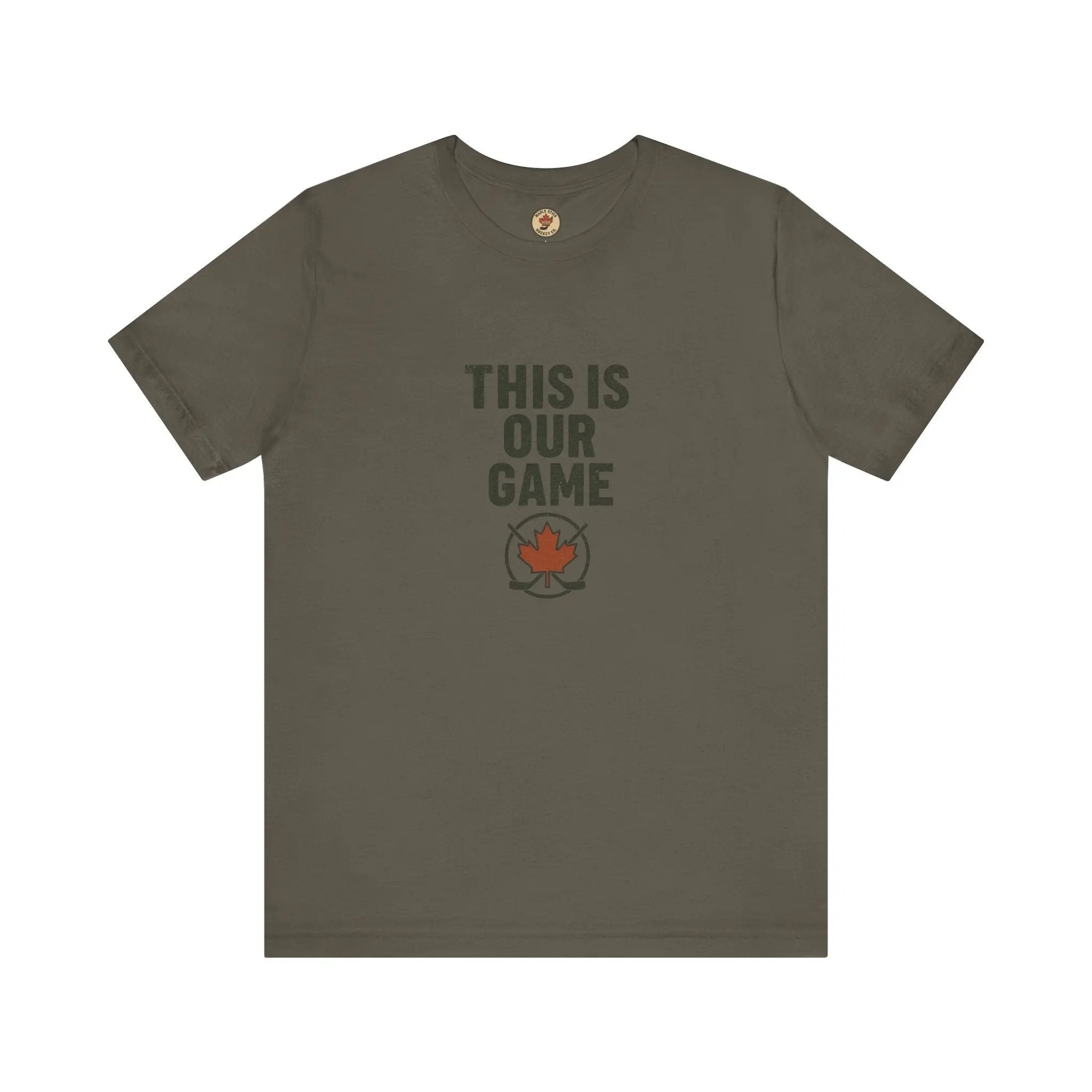 Green women’s T-shirt with ‘This Is Our Game’ text and maple leaf graphic – Maple Stick Hockey product.