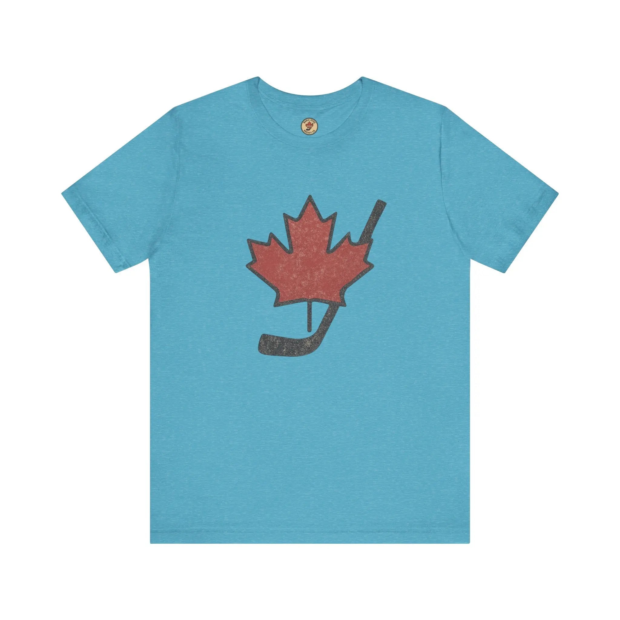 Teal T-shirt with maple leaf and hockey stick graphic on front on white background
