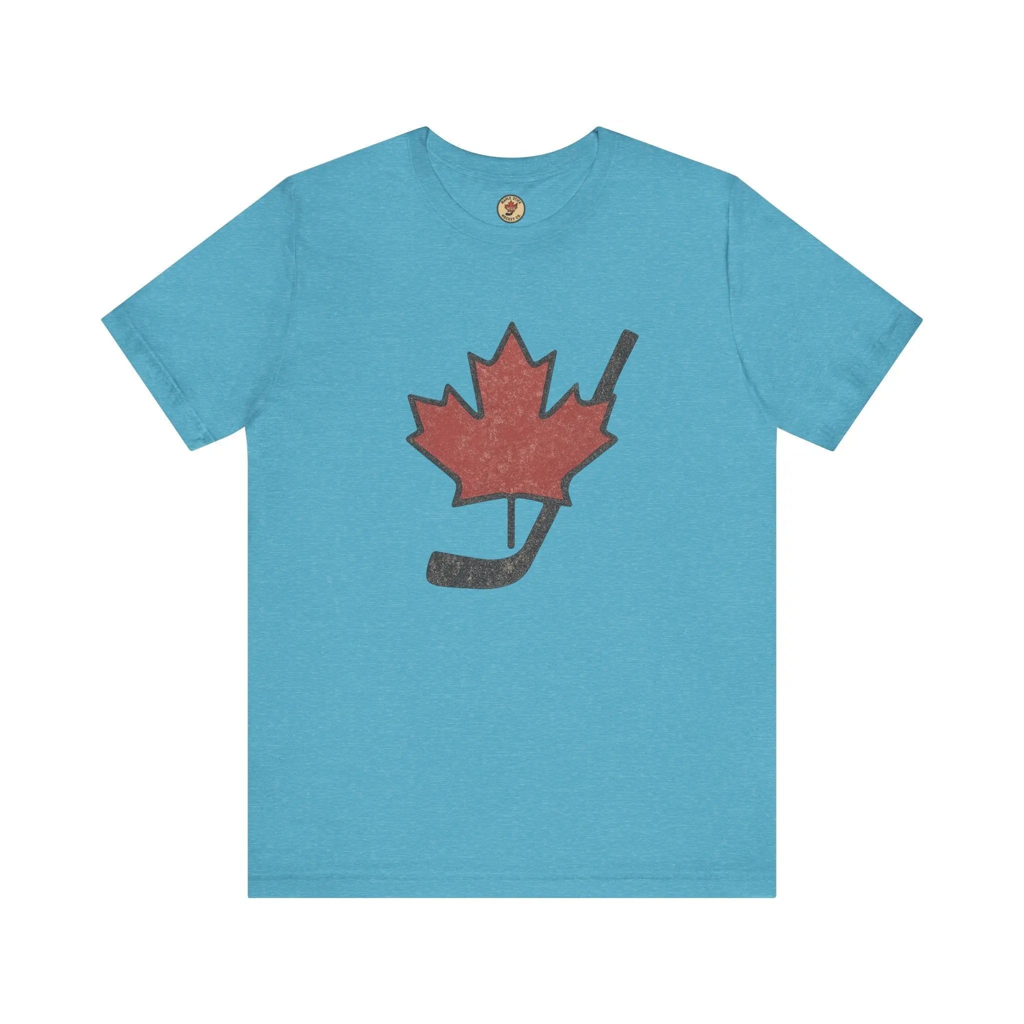 Teal T-shirt with maple leaf and hockey stick graphic on front on white background