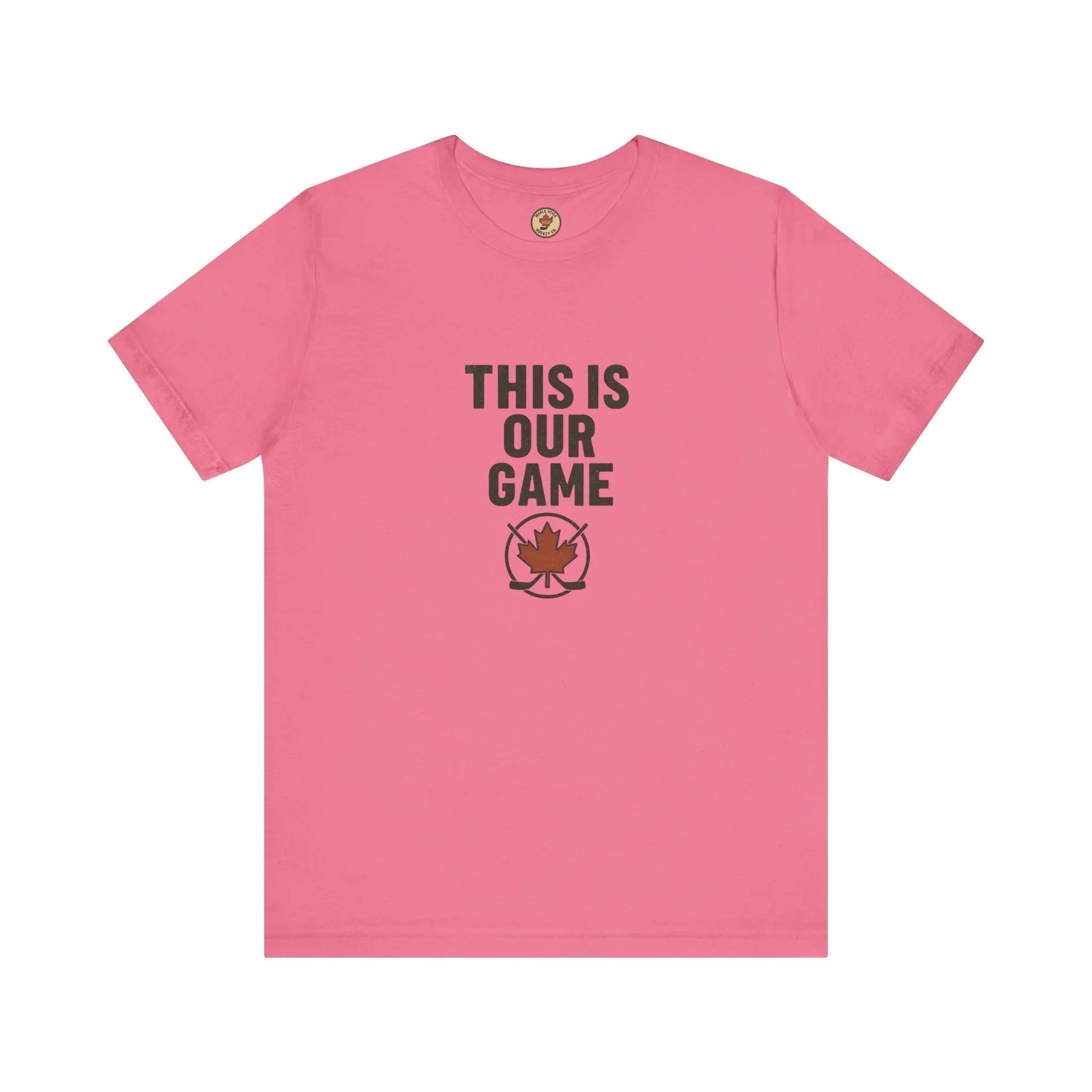 Pink women’s T-shirt with ‘This Is Our Game’ text and maple leaf graphic – Maple Stick Hockey product.