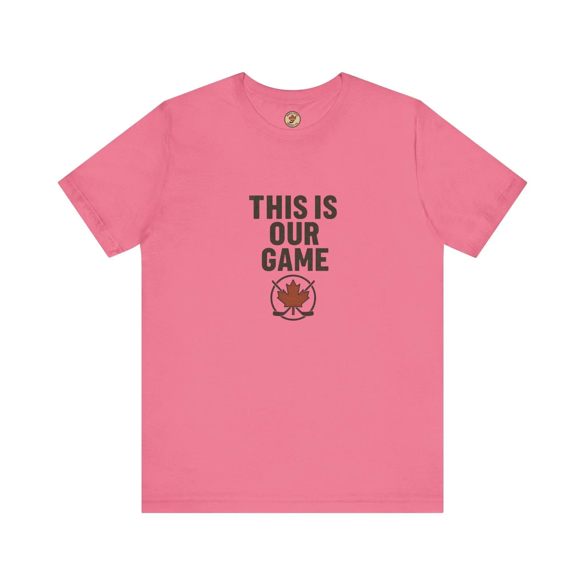 Pink women’s T-shirt with ‘This Is Our Game’ text and maple leaf graphic – Maple Stick Hockey product.