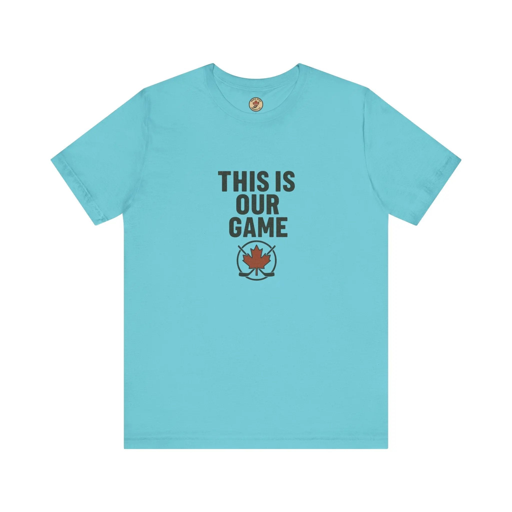 Light turquoise women’s T-shirt with ‘This Is Our Game’ text and maple leaf graphic – Maple Stick Hockey product.