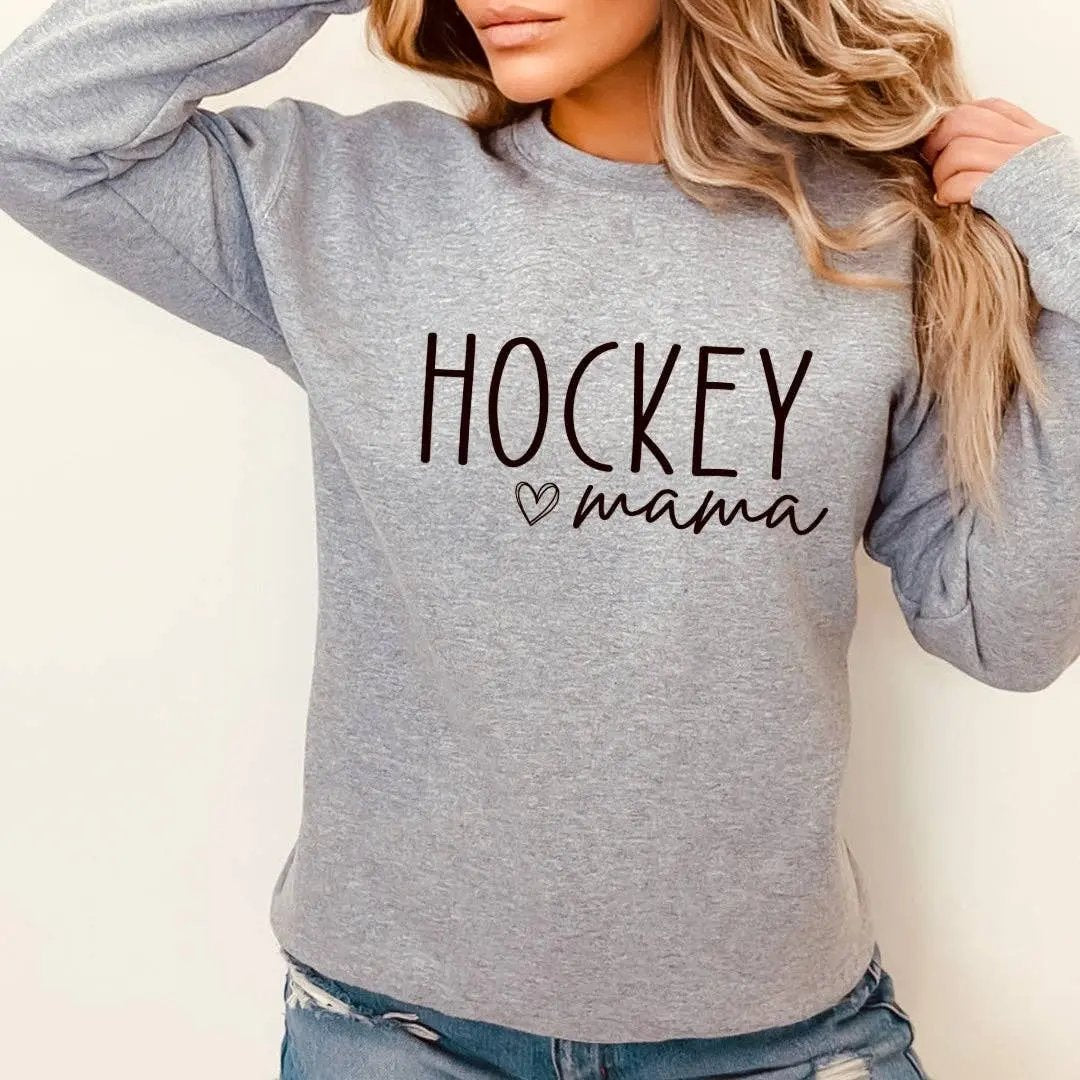 Woman wearing grey 'Hockey mama' crewneck sweatshirt with brown script design – Maple Stick Hockey product
