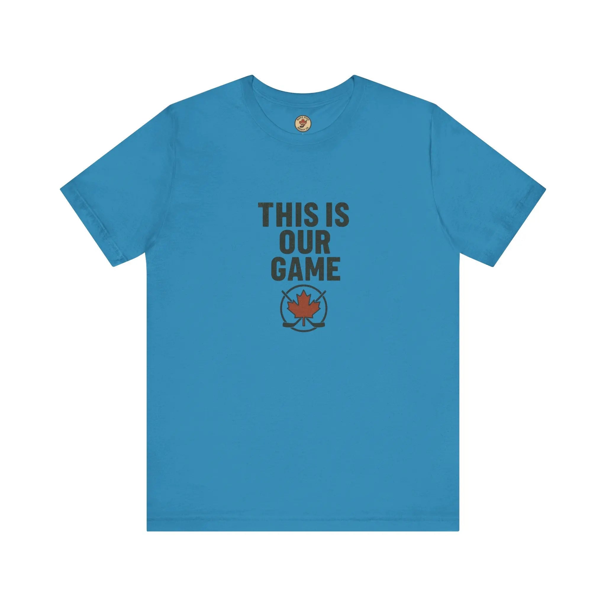 Blue women’s T-shirt with 'This Is Our Game' text and maple leaf graphic – Maple Stick Hockey product.