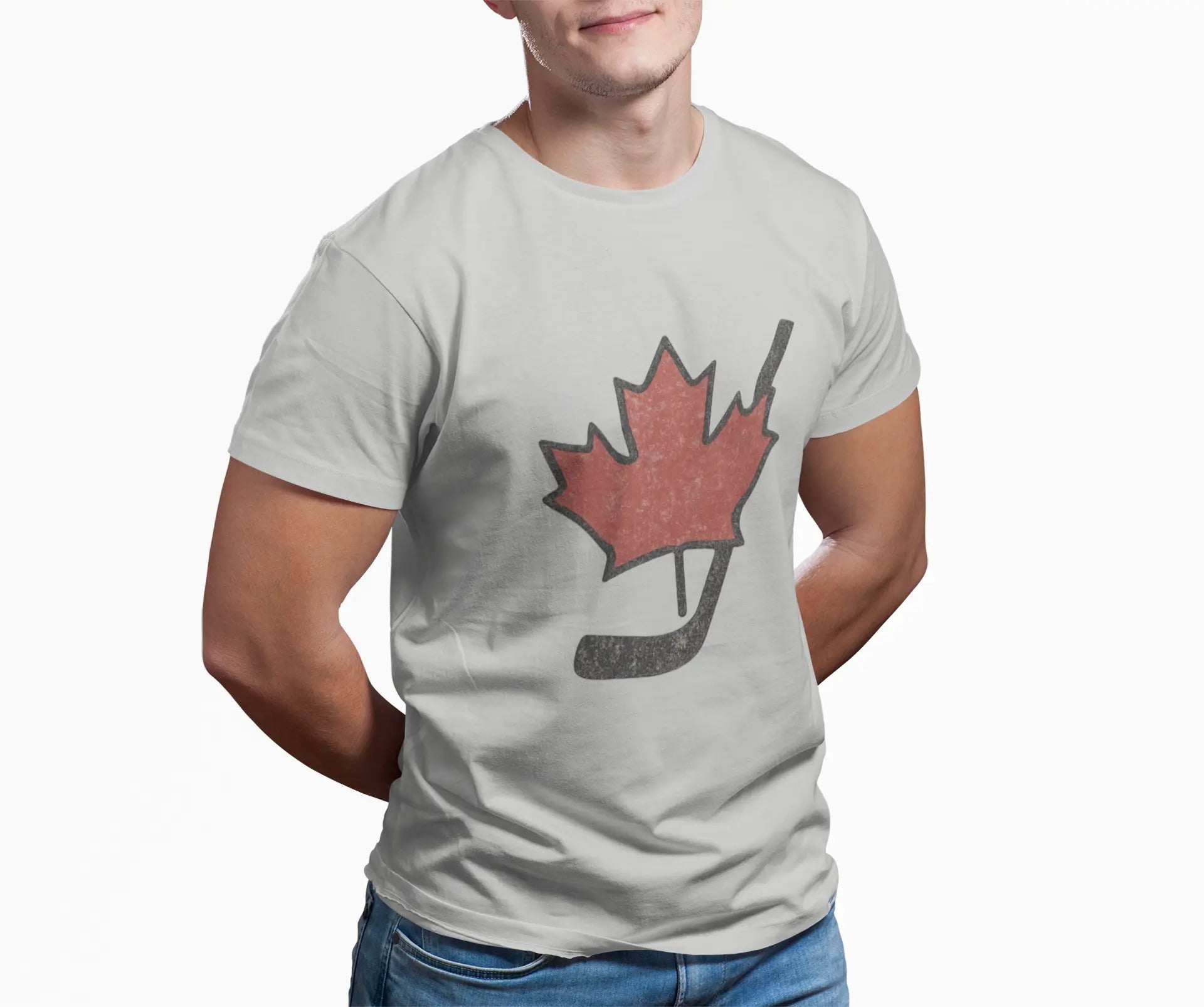 Person wearing a grey Maple Leaf hockey stick T-shirt with red maple leaf and hockey stick design on front