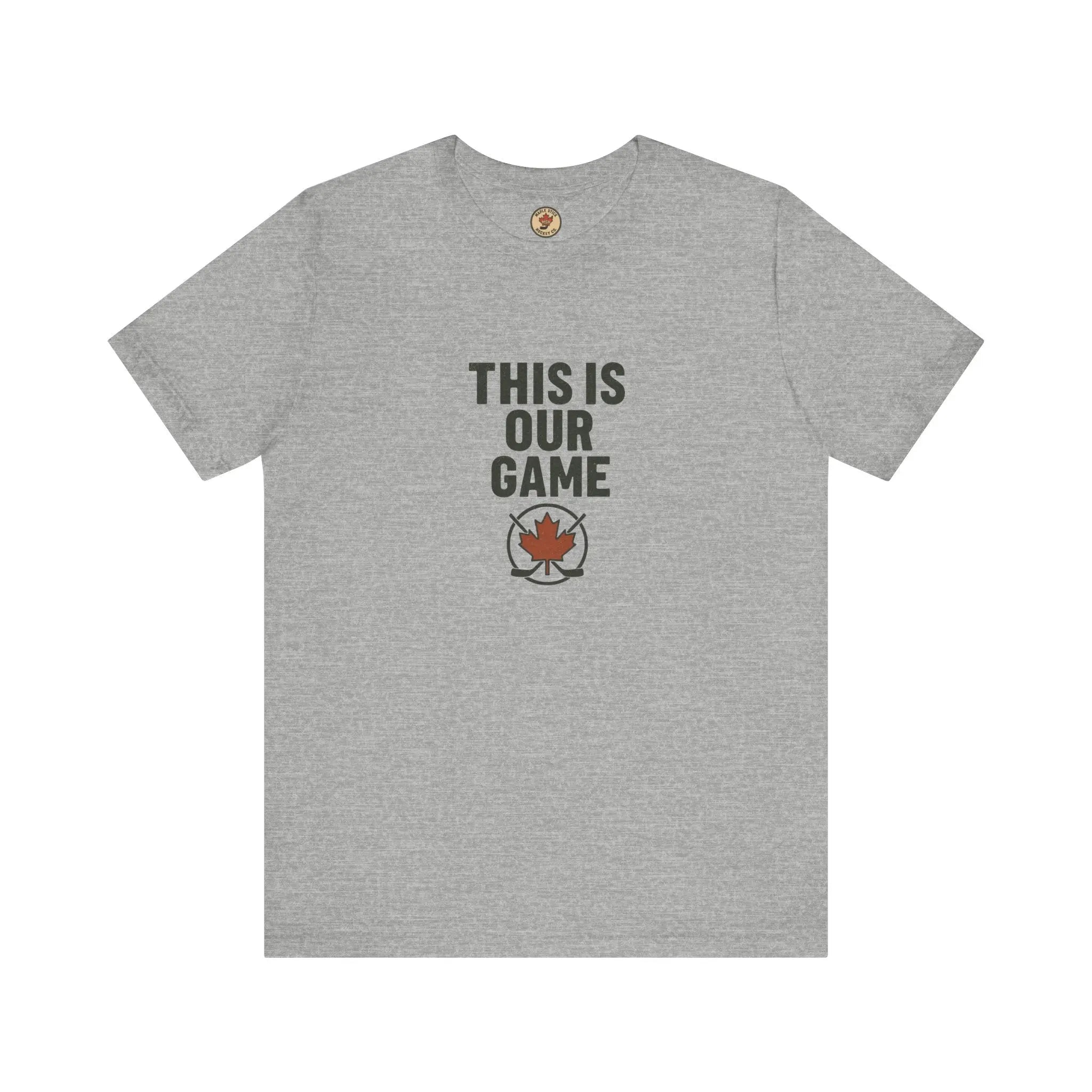 Grey T-shirt with 'This Is Our Game' text and maple leaf graphic on front